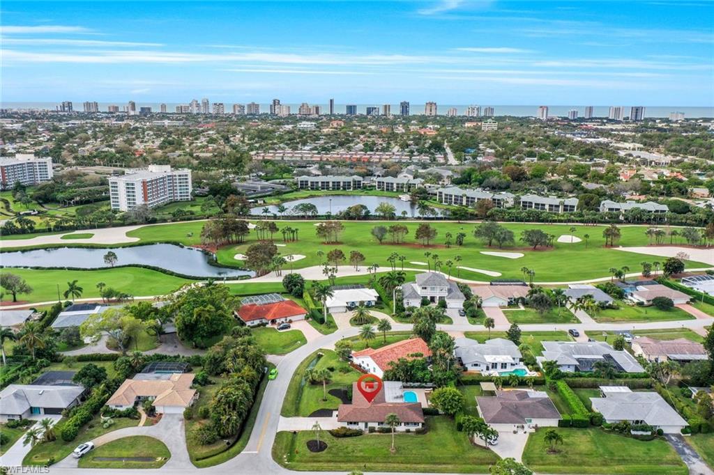 289 Burning Tree Drive Naples, FL 34105 - Photo 36 of 36 an aerial view of tennis court