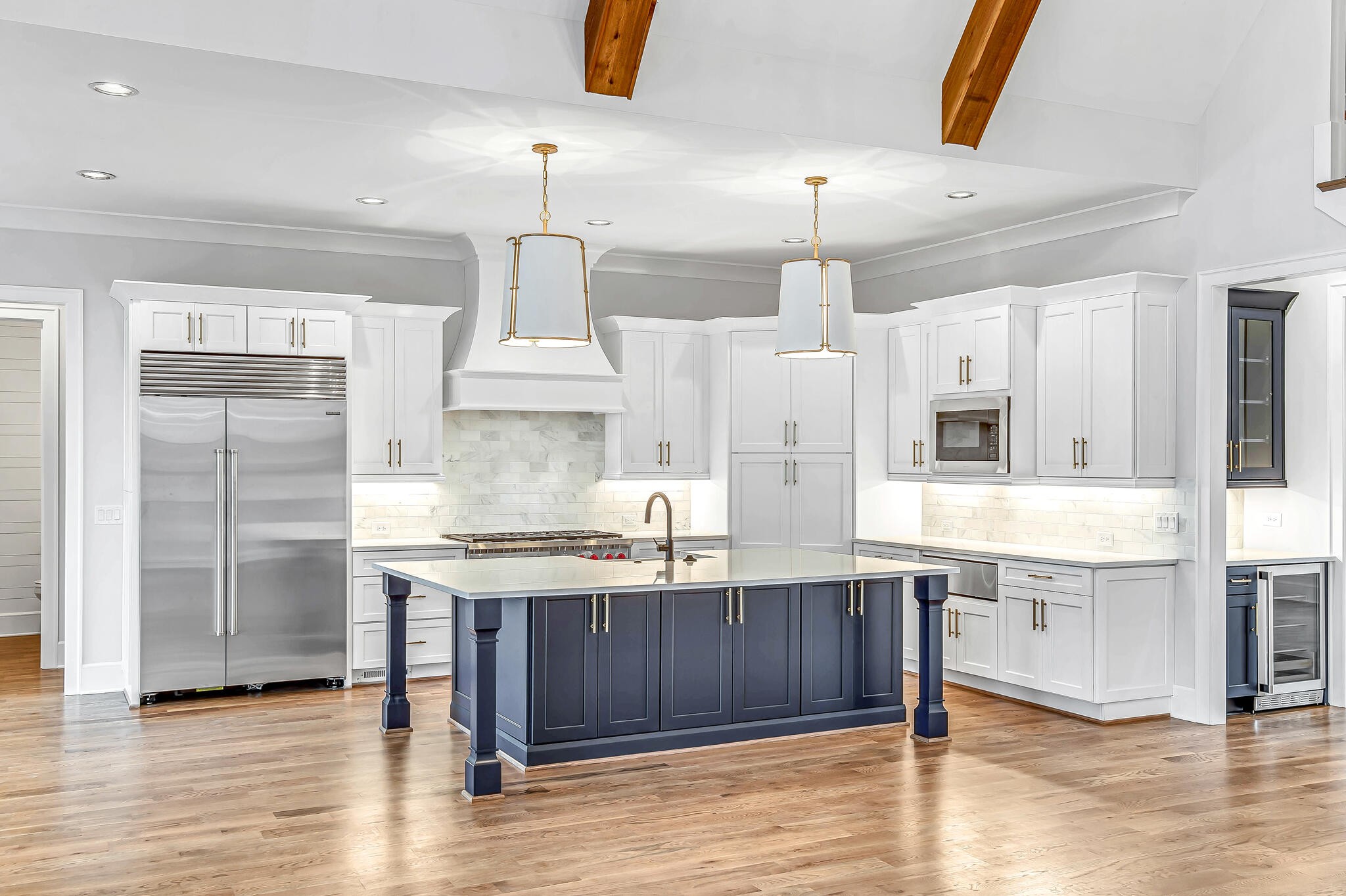 1891 Traditions Circle Franklin, TN 37067 - Photo 20 of 50 a kitchen with kitchen island granite countertop a sink cabinets and stainless steel appliances