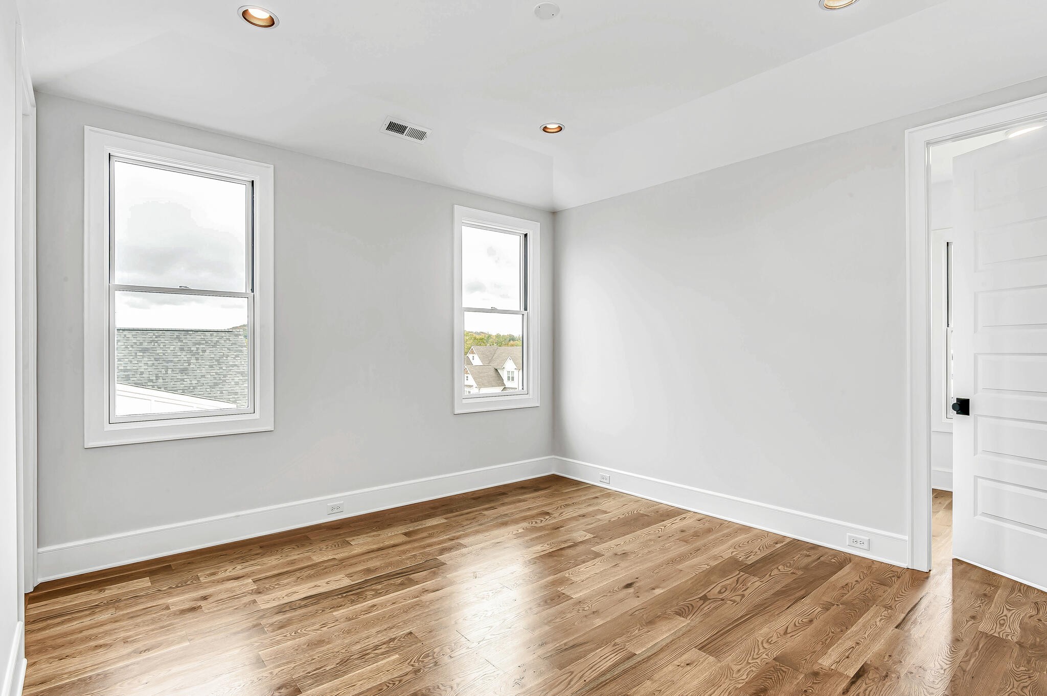 1891 Traditions Circle Franklin, TN 37067 - Photo 37 of 50 an empty room with wooden floor and windows