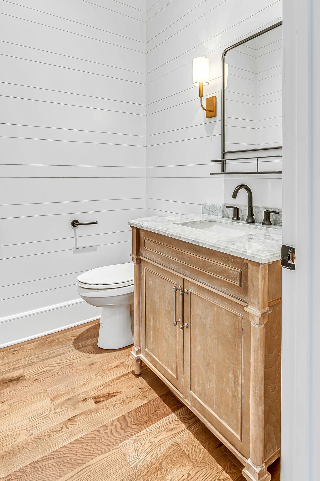 1891 Traditions Circle Franklin, TN 37067 - Photo 48 of 50 a bathroom with a granite countertop sink a toilet and a mirror