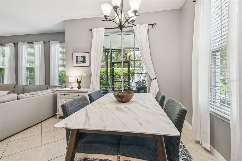 7001 Interbay Boulevard, Unit 134 Tampa, FL 33616 - Photo 19 of 84 a view of a dining room with furniture window and outside view