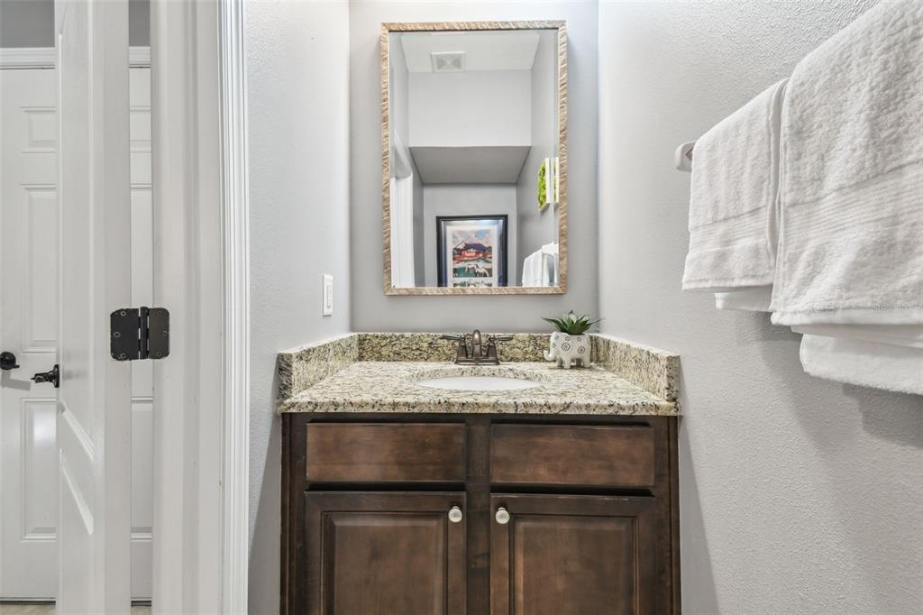 7001 Interbay Boulevard, Unit 134 Tampa, FL 33616 - Photo 24 of 84 a bathroom with a granite countertop sink and a mirror