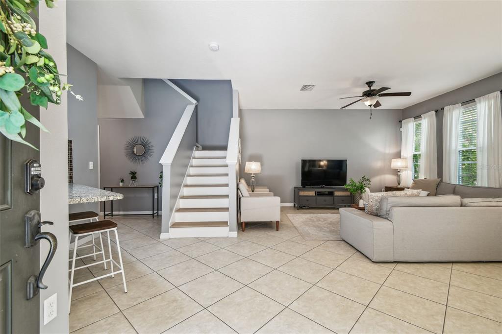 7001 Interbay Boulevard, Unit 134 Tampa, FL 33616 - Photo 3 of 84 a living room with furniture and a flat screen tv