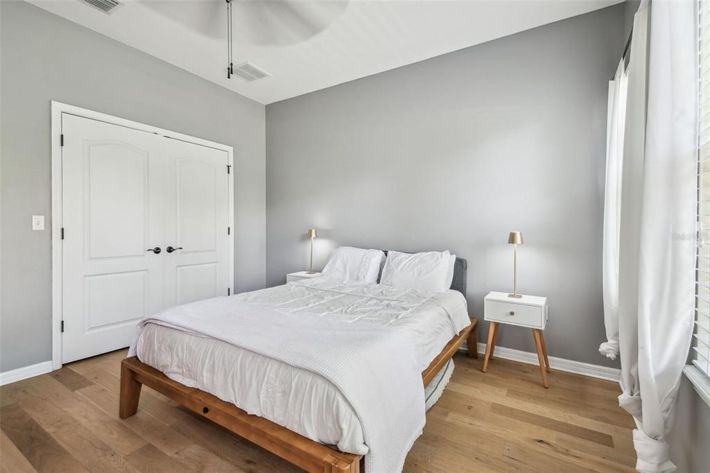 7001 Interbay Boulevard, Unit 134 Tampa, FL 33616 - Photo 33 of 84 a bedroom with a bed and a lamp