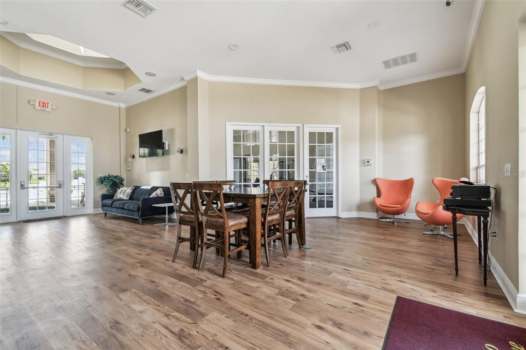 7001 Interbay Boulevard, Unit 134 Tampa, FL 33616 - Photo 62 of 84 a view of a dining room with furniture and wooden floor