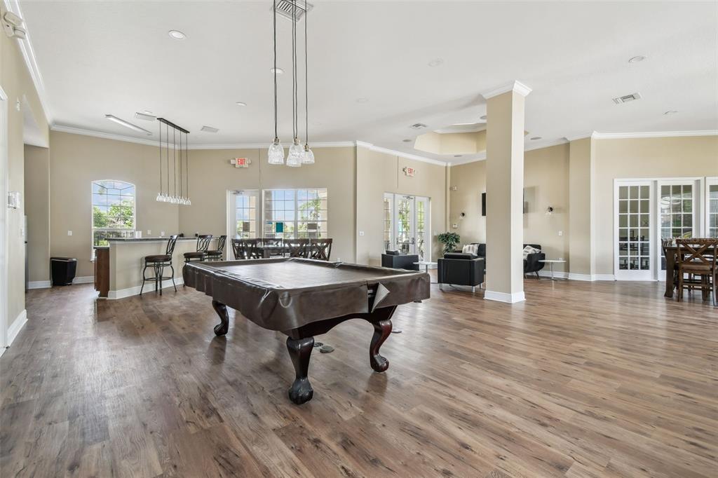 7001 Interbay Boulevard, Unit 134 Tampa, FL 33616 - Photo 63 of 84 a view of a a dining room with furniture window and wooden floor