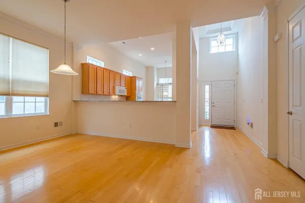 a living room with furniture and large windows