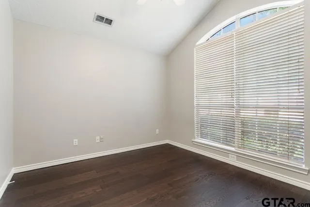 wooden floor and window in an empty room