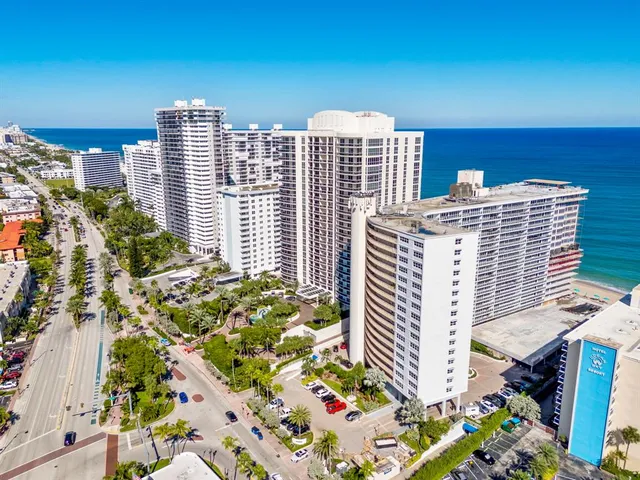 a view of backyard with barbeque grill stove and seating area