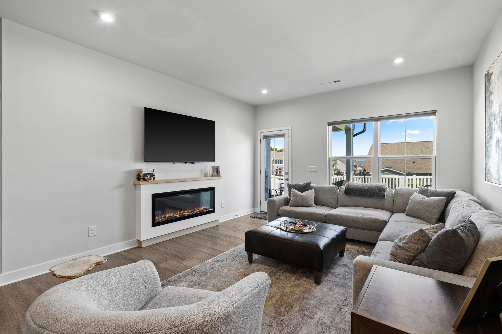 203 Pitchfork Way Gallatin, TN 37066 - Photo 19 of 39 a living room with furniture a fireplace and a flat screen tv