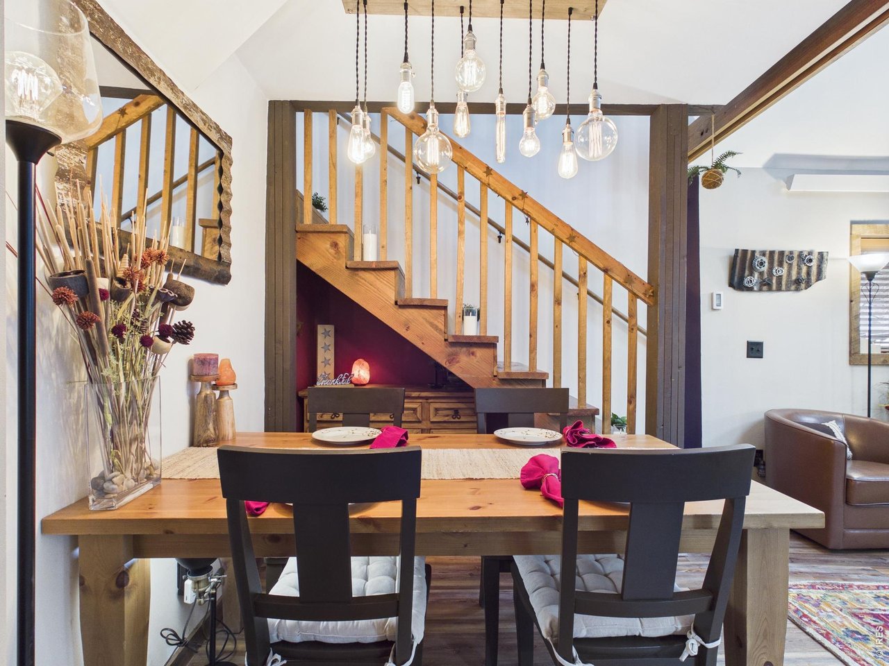 131 West Boulder Street Nederland, CO 80466 - Photo 7 of 46 Separate dining area, candles, under stair storage, wood beams, rustic, Edison hanging light.