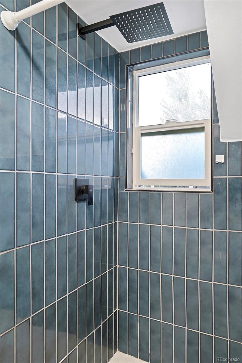 701 Galapago Street Denver, CO 80204 - Photo 25 of 38 a bathroom with a window and a shower