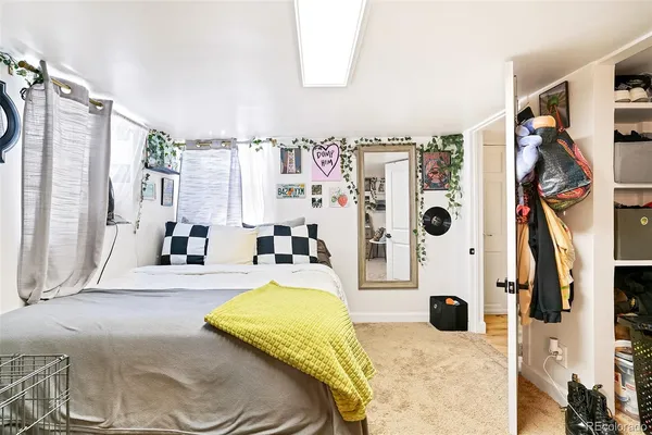a kitchen with white cabinets and sink