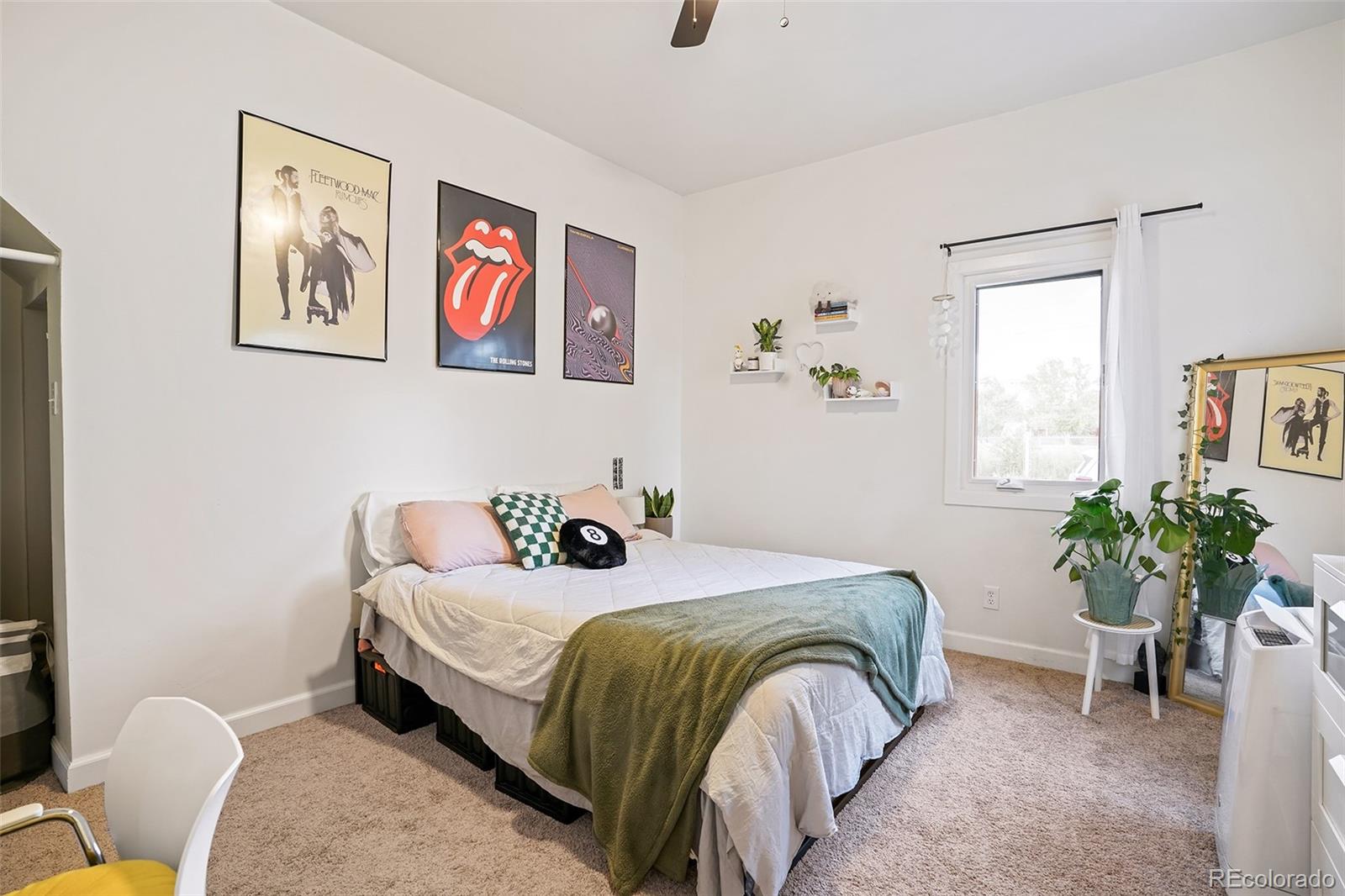 701 Galapago Street Denver, CO 80204 - Photo 9 of 38 a bedroom with a bed and a couch