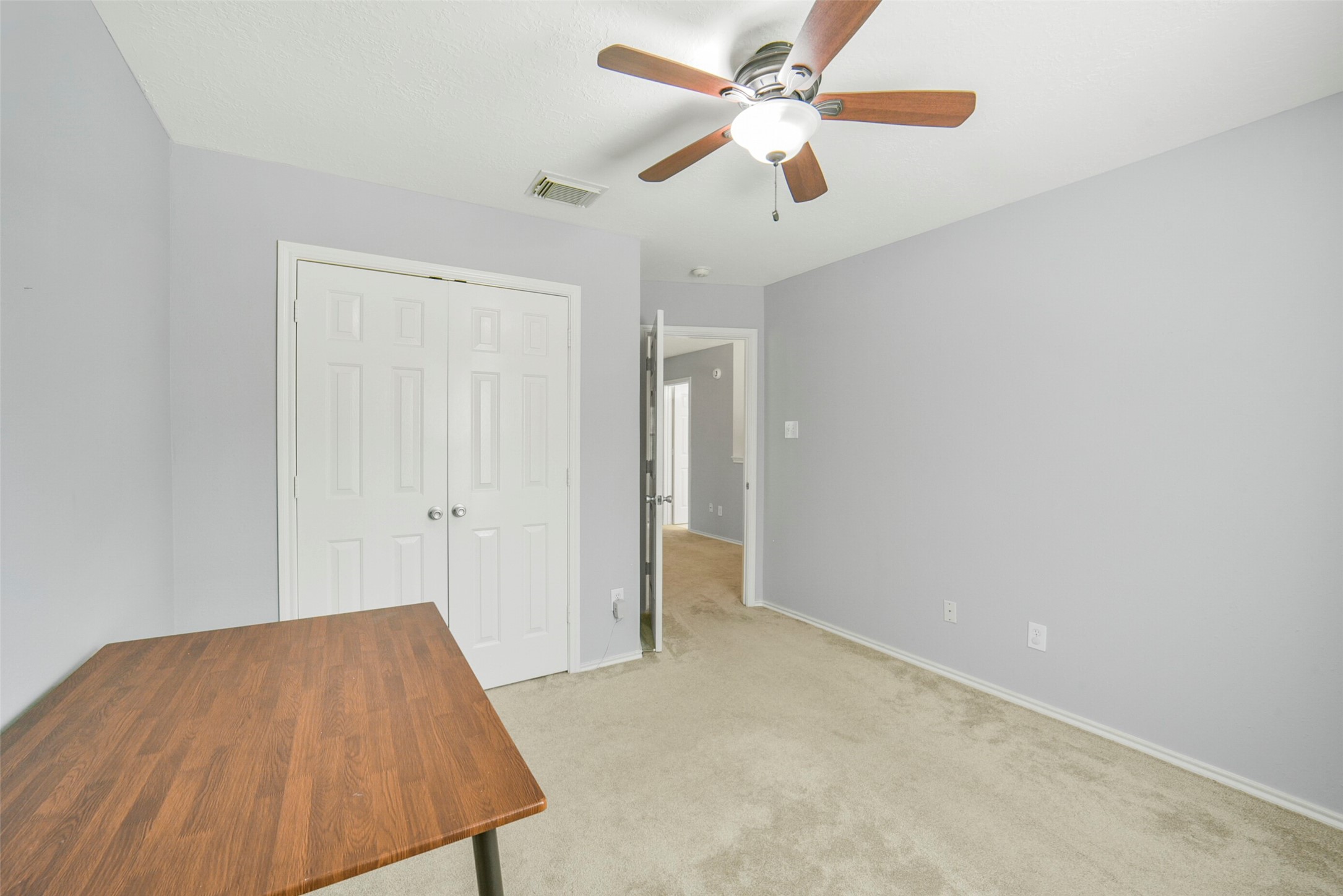 38 Tallow Hill Place Spring, TX 77382 - Photo 30 of 50 an empty room with closet and a ceiling fan