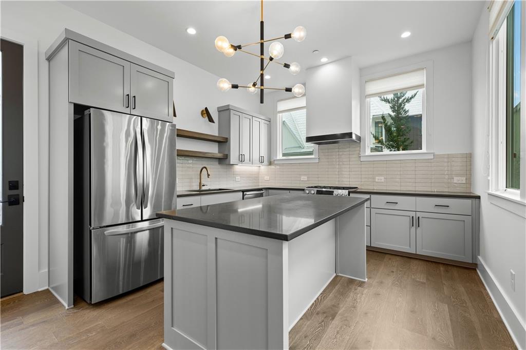 255 High Street Fayetteville, GA 30214 - Photo 13 of 67 a kitchen with granite countertop a refrigerator and a sink
