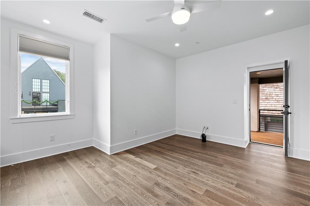 255 High Street Fayetteville, GA 30214 - Photo 20 of 67 an empty room with wooden floor and a window