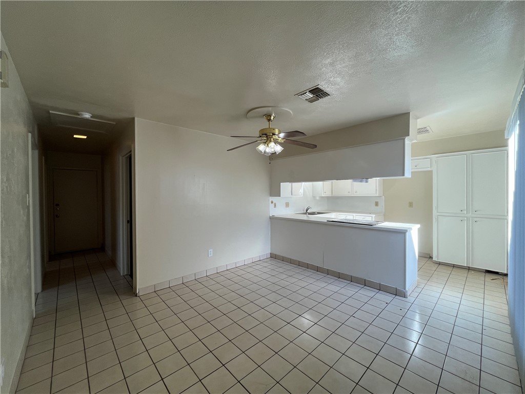 5002 Wingfoot Lane, Unit A Corpus Christi, TX 78413 - Photo 16 of 25 a view of cabinets and window