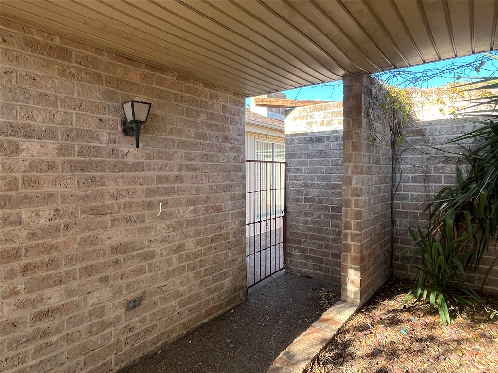 5002 Wingfoot Lane, Unit A Corpus Christi, TX 78413 - Photo 2 of 25 a view of a brick wall