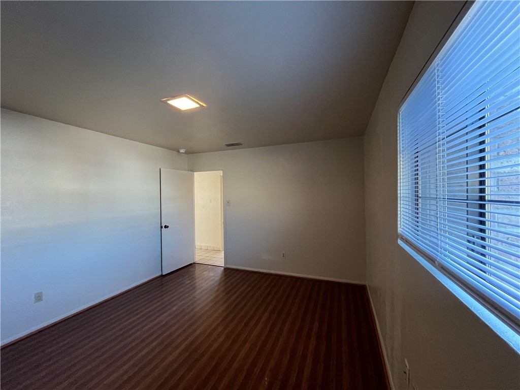 5002 Wingfoot Lane, Unit A Corpus Christi, TX 78413 - Photo 21 of 25 a view of an empty room with wooden floor