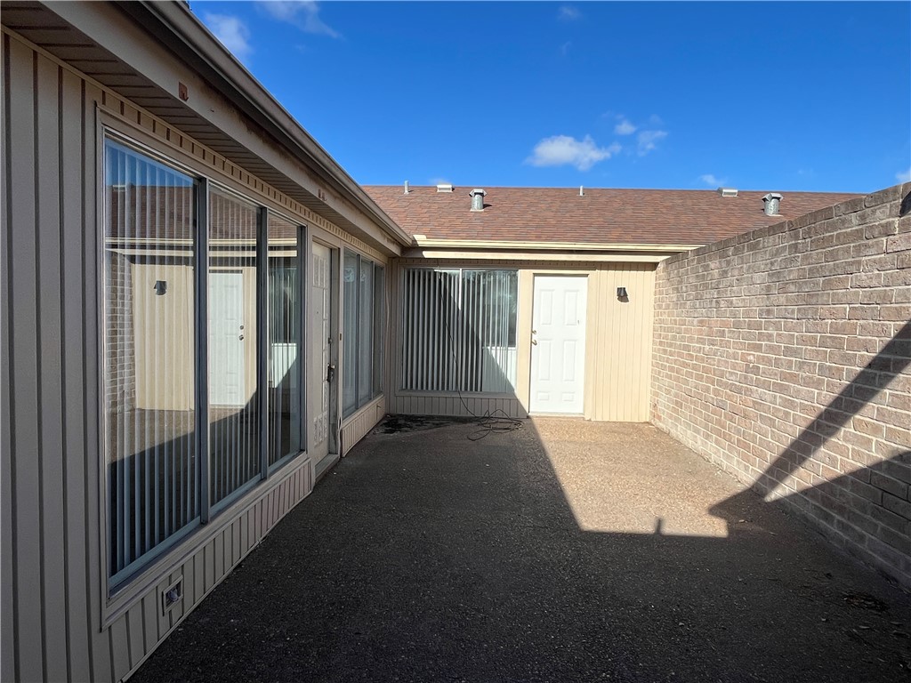 5002 Wingfoot Lane, Unit A Corpus Christi, TX 78413 - Photo 3 of 25 a view of a house with a street