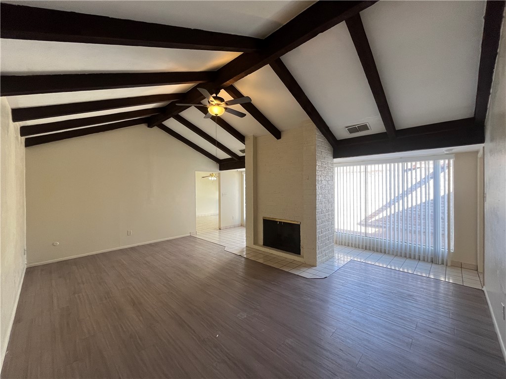 5002 Wingfoot Lane, Unit A Corpus Christi, TX 78413 - Photo 8 of 25 a view of empty room with wooden floor and fan