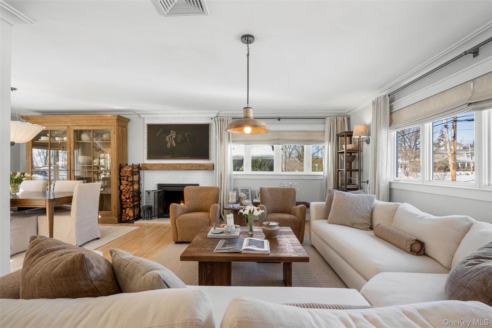 87 Inverness Road New Rochelle, NY 10804 - Photo 4 of 29 Fuller view of living room with peak of dining area and fireplace