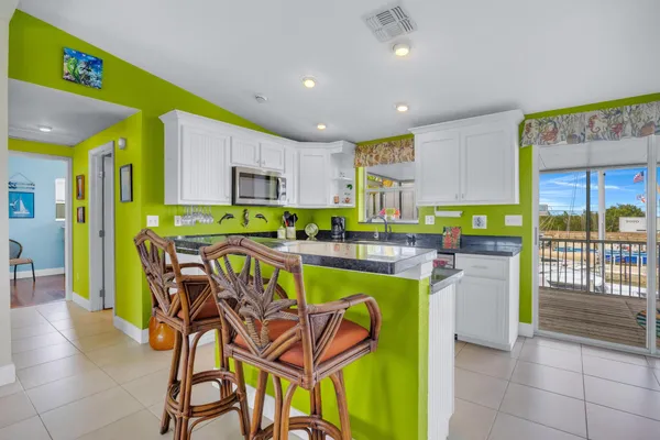 a kitchen with stainless steel appliances granite countertop a sink and cabinets