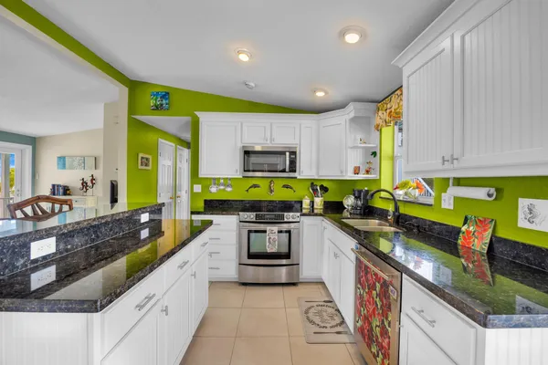 a bathroom with a sink a mirror and a toilet