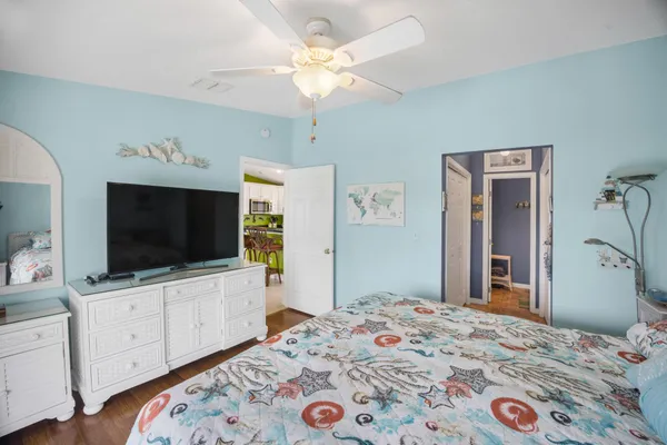 a bedroom with a bed and a chandelier