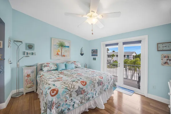 a bedroom with a bed and a view of bathroom