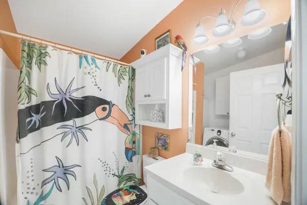 a workspace with furniture and a chandelier fan