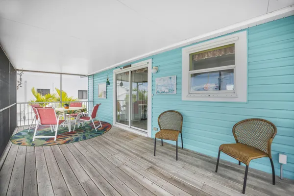 a terrace with outdoor seating and city view