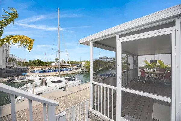 a ocean view with a sitting space and furniture