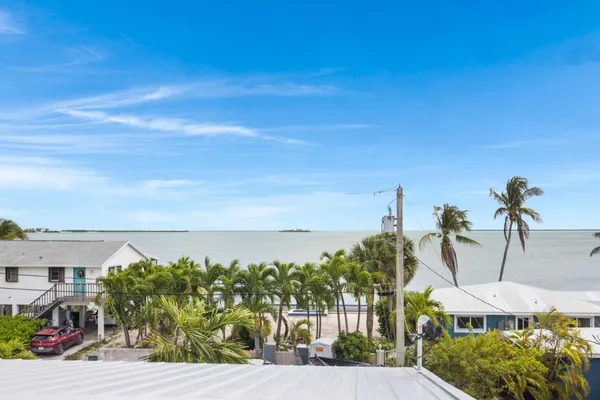 an aerial view of residential house with outdoor space and swimming pool