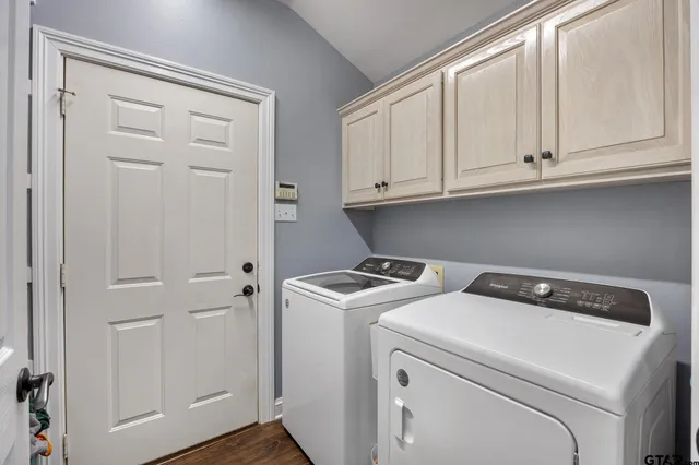 a utility room with dryer and washer