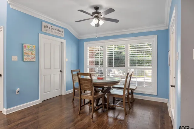 a view of a dining room with furniture window and wooden floor