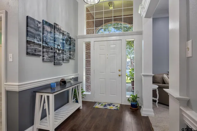 a view of entryway with wooden floor