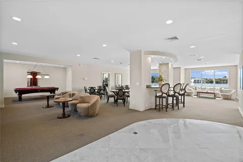a lobby with furniture and a potted plant