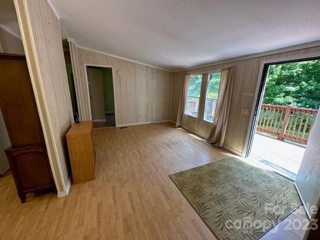 143 Hubert McCall Drive Balsam Grove, NC 28708 - Photo 12 of 19 wooden floor in an empty room with a window