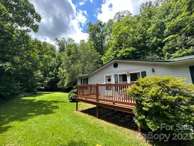 143 Hubert McCall Drive Balsam Grove, NC 28708 - Photo 17 of 19 a view of a house with a yard and deck