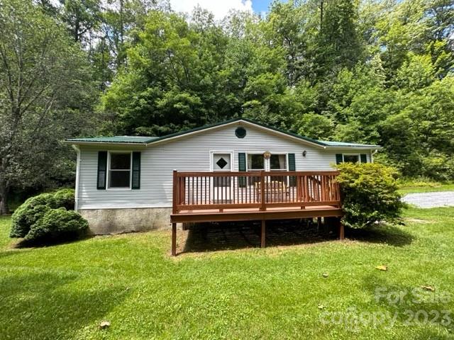 143 Hubert McCall Drive Balsam Grove, NC 28708 - Photo 2 of 19 a view of a house with a yard and deck