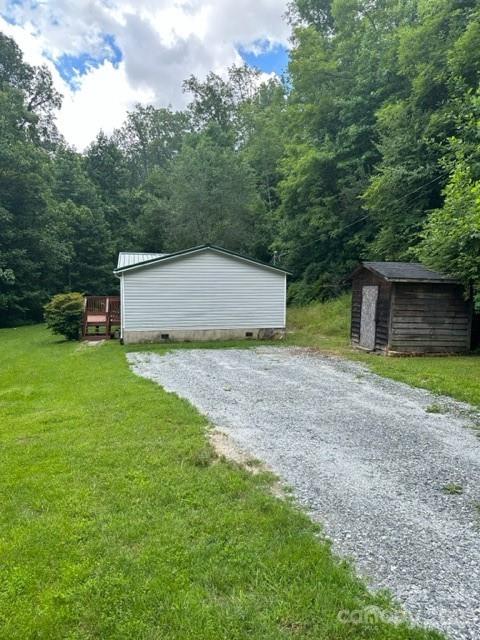 143 Hubert McCall Drive Balsam Grove, NC 28708 - Photo 6 of 19 a view of a house with backyard and trees