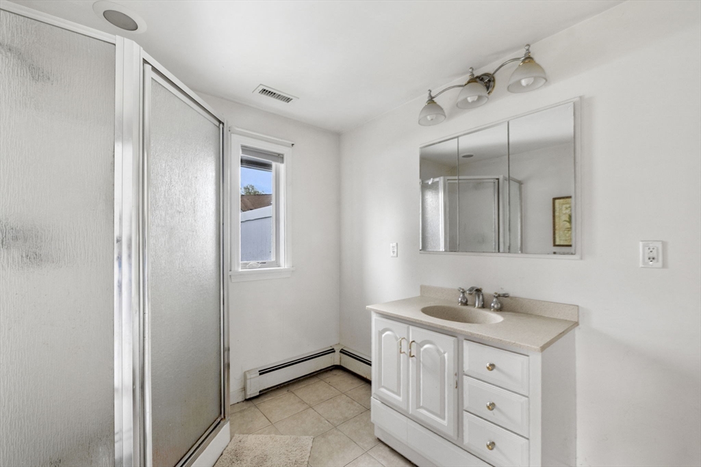 4 Dondi Road Beverly, MA 01915 - Photo 8 of 13 a bathroom with a double vanity sink mirror and
