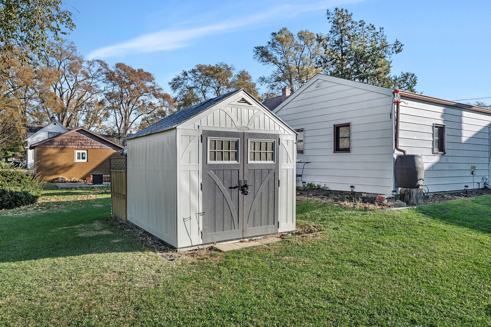 711 Clinton Street Lockport, IL 60441 - Photo 21 of 22 a front view of a house with a garden