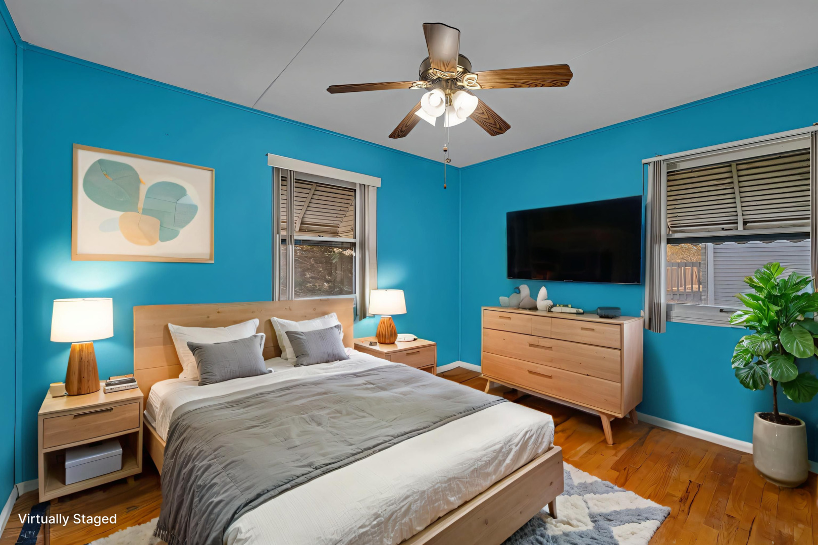 711 Clinton Street Lockport, IL 60441 - Photo 7 of 22 a bedroom with a bed and a flat screen tv