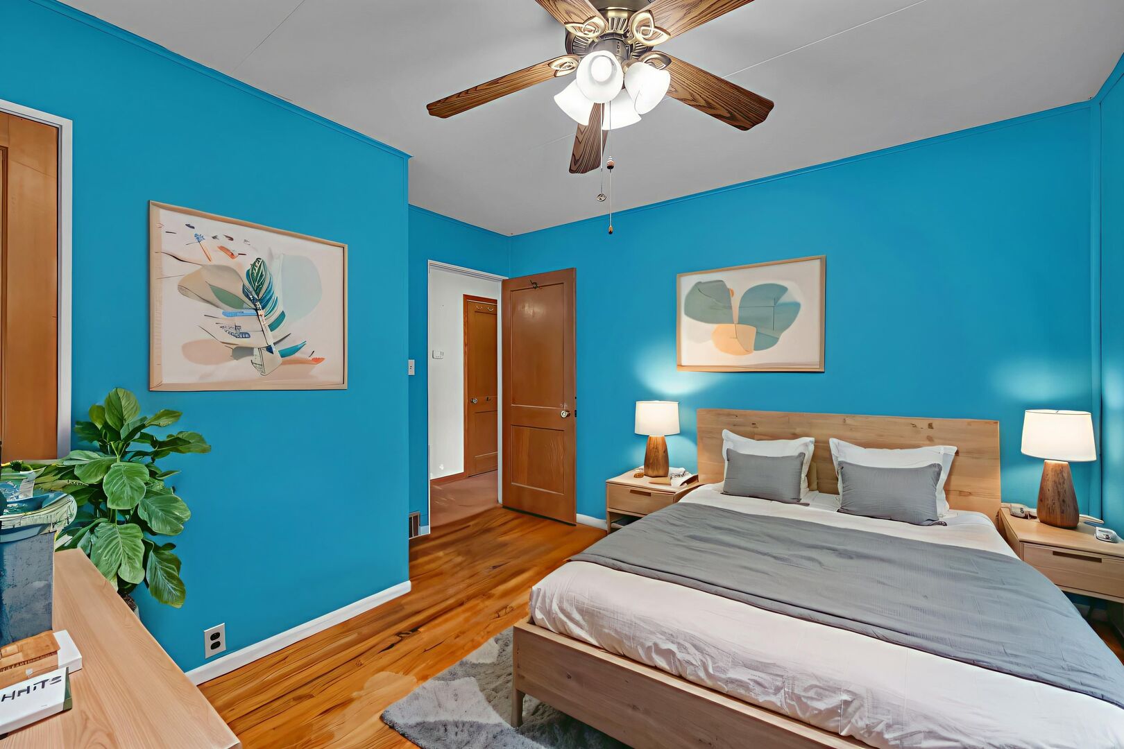 711 Clinton Street Lockport, IL 60441 - Photo 8 of 22 a bedroom with a bed and a potted plant