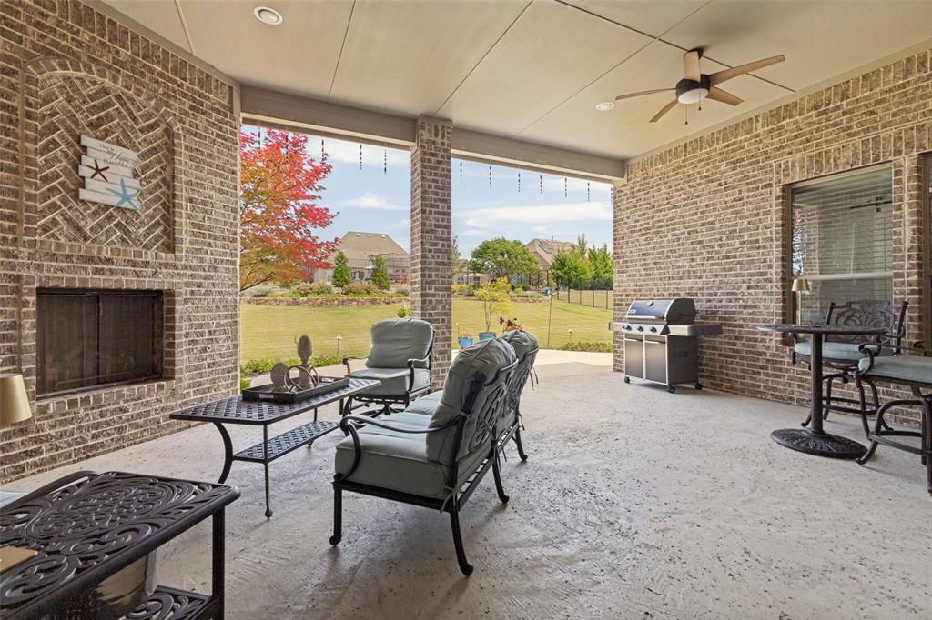 506 Life Spring Drive Rockwall, TX 75087 - Photo 30 of 36 a living room with furniture and a fireplace
