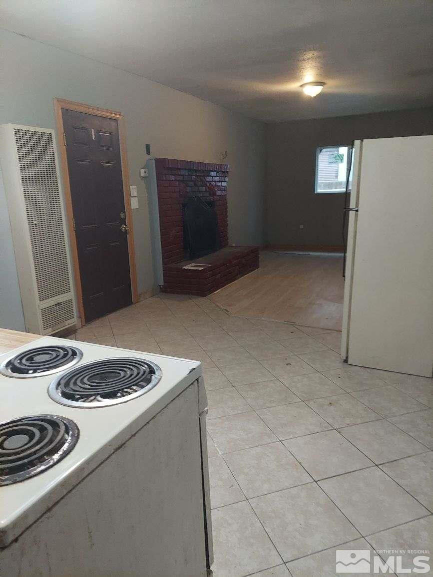 301 East Grove Street, Unit 2 Reno, NV 89502 - Photo 8 of 15 a kitchen with a stove and a refrigerator