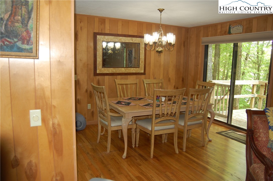 114 Lady Slipper Loop Newland, NC 28657 - Photo 18 of 50 a view of a dining room with furniture window and wooden floor